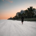 person walking on a beach