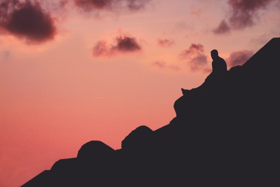 A man sitting on a rock