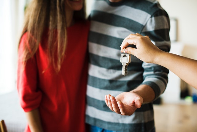 A couple getting the keys to their new home