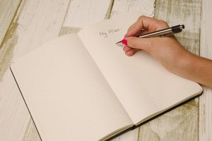 a girl writing down a plan