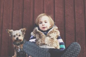 moving to tampa can be stressful for children and pets. A child with his dog